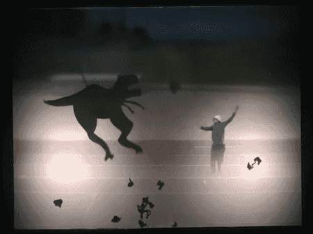 l'écran de la Boîte à Rêves avec le personnag principal, des bouts de cerveau et un dinosaure